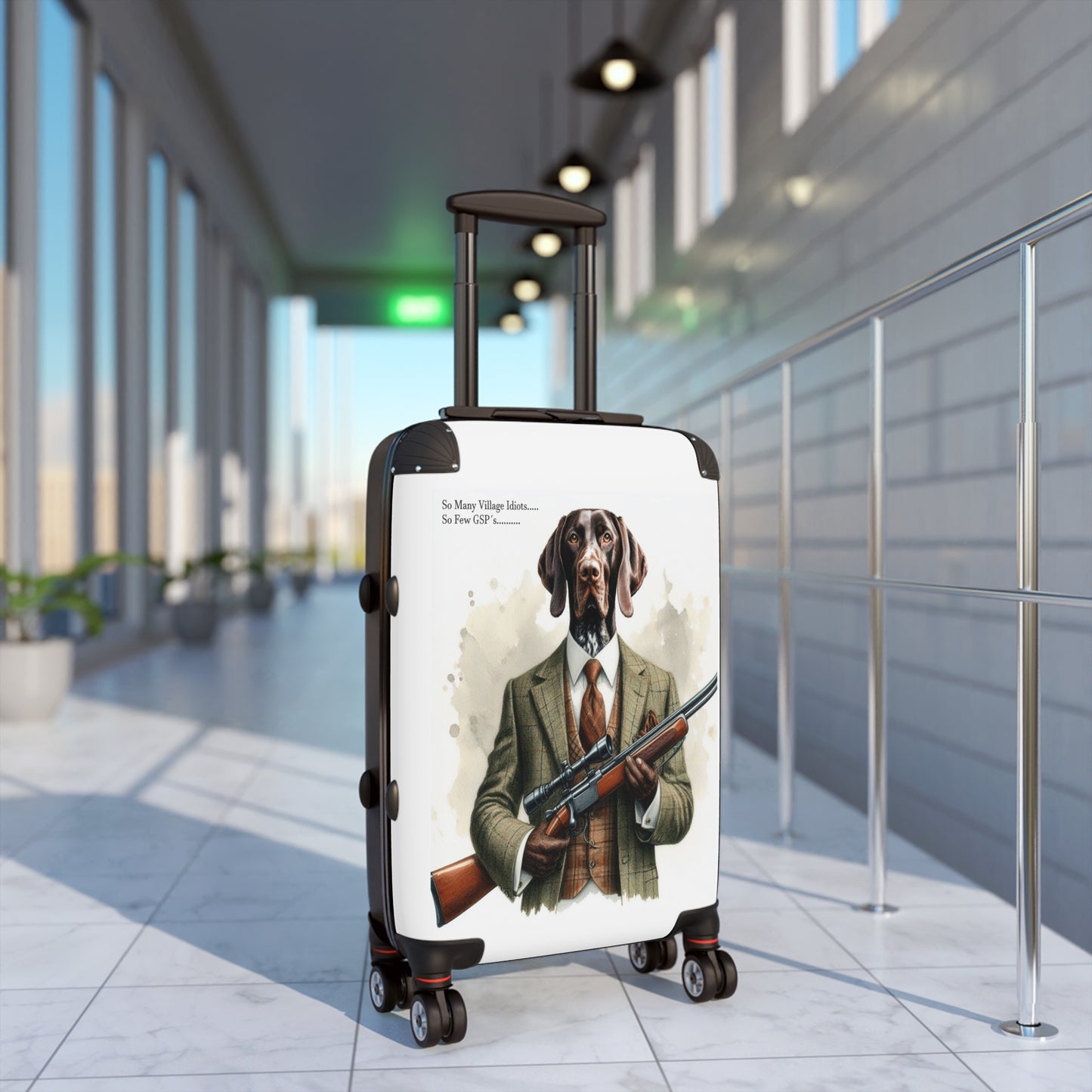Ah, the quintessential suitcase for the discerning traveler: the “Village Idiot Deluxe.”